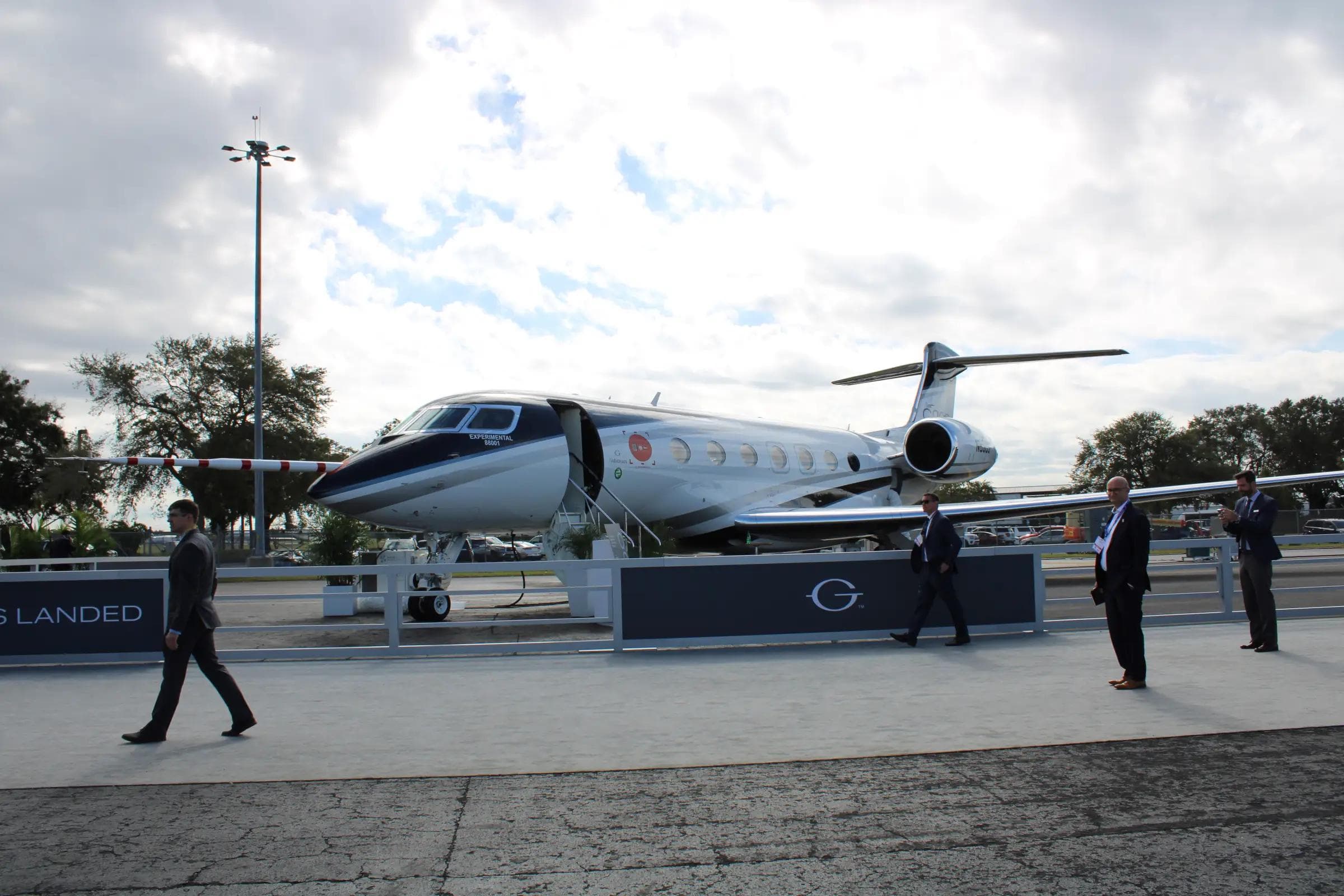 Gulfstream G800 business jet on display at the 2022 NBAA-BACE show at Orlando Executive Airport, showing the aircraft's swept wing and oval cabin windows
