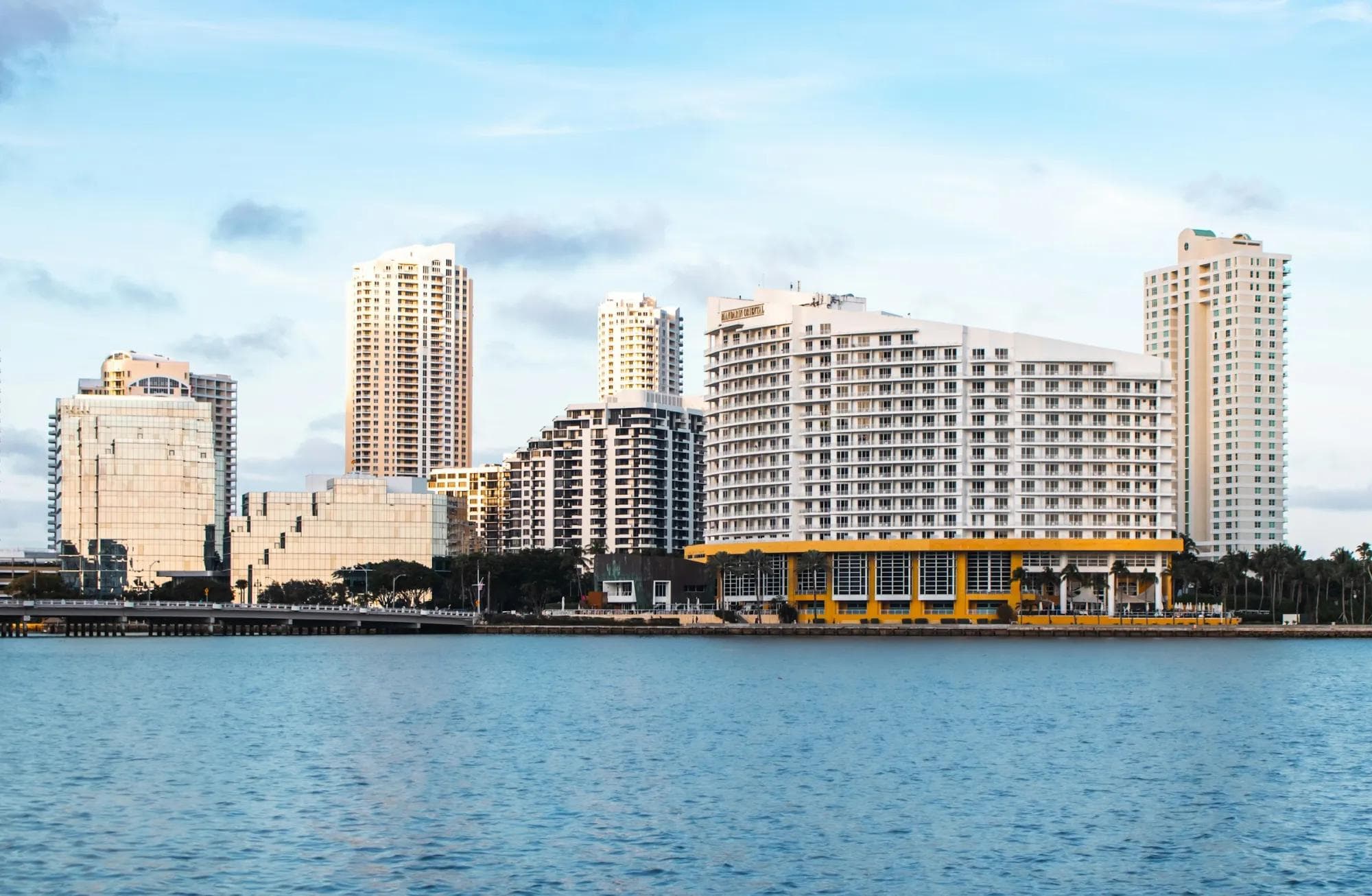 The Mandarin Oriental Miami and Brickell Key towers along Biscayne Bay at golden hour